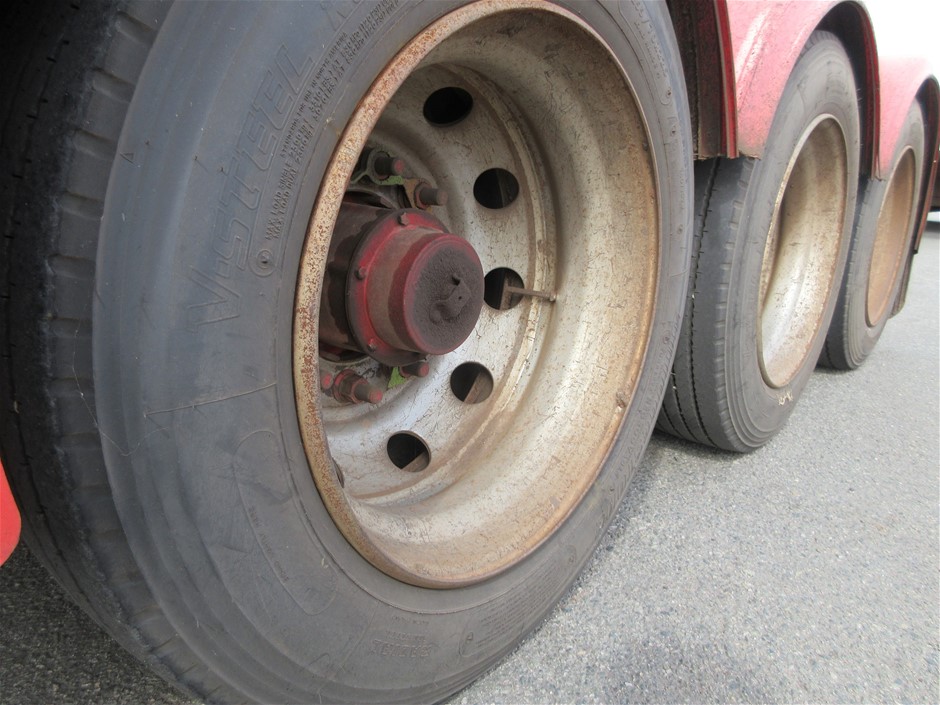 Rash Vest Made With Water Reactive Fabric Showing Dolphin Print When Wet