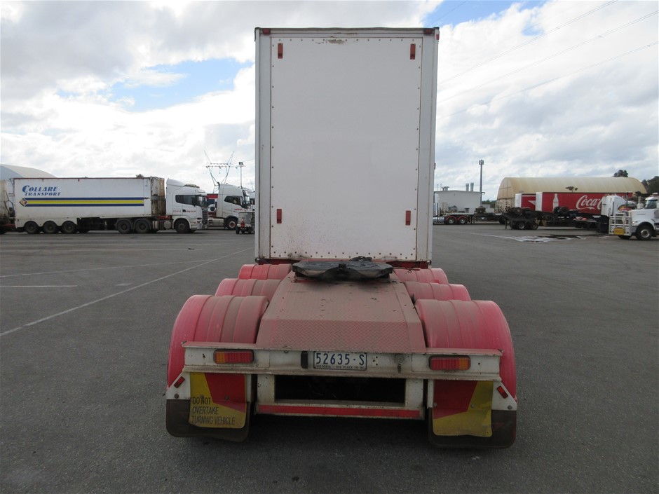 Rash Vest Made With Water Reactive Fabric Showing Dolphin Print When Wet