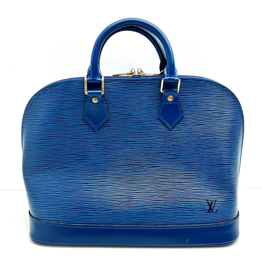 At Auction: Louis Vuitton, LOUIS VUITTON Handbag ALMA PM.