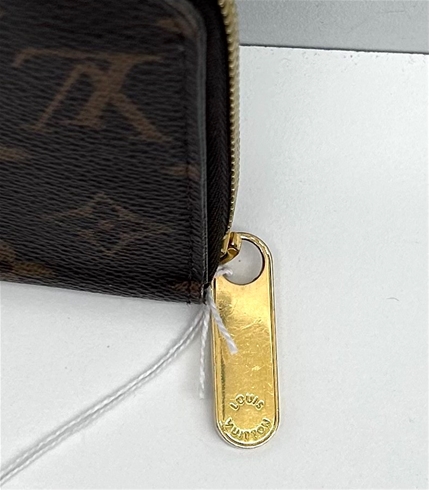 Cash system in a Louis Vuitton zippy coin purse