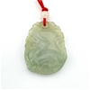 CARVED JADE CHINESE DRAGON PENDANT ON A RED NECKLACE