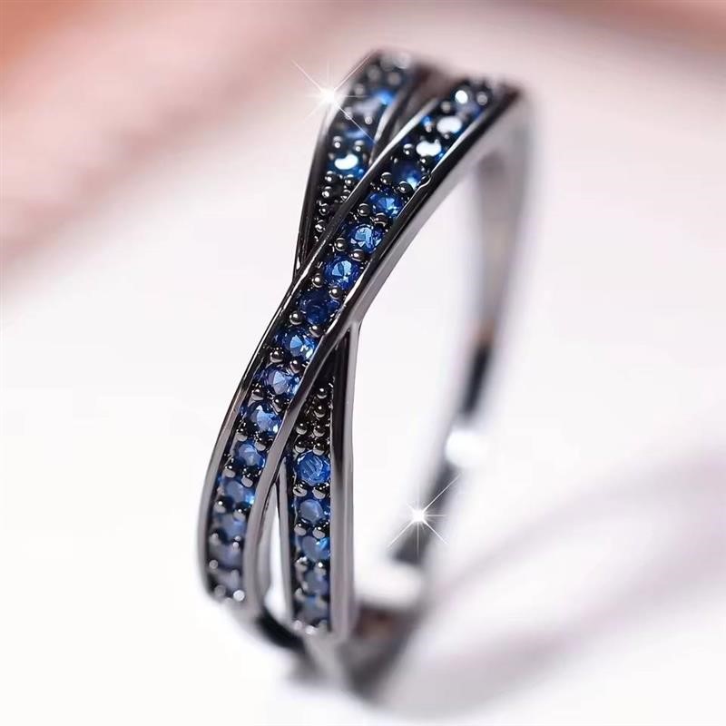 Designer Blue Simulated Diamond Crossover Ring in Black - US Size 7