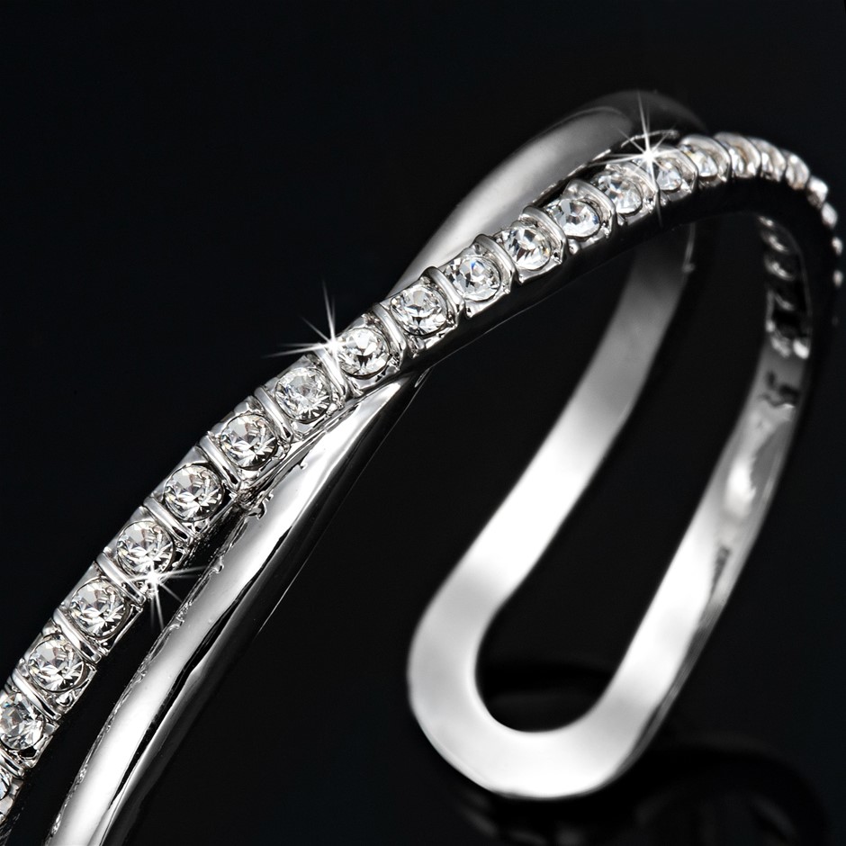 Rhodium Plated Crossover Bangle Featuring 13 Crystals by Swarovski®