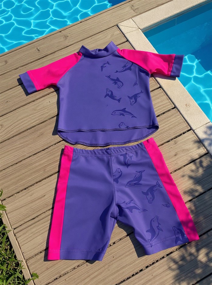 Spliced Short Made of Water Reactive Fabric Showing Dolphin Print When Wet