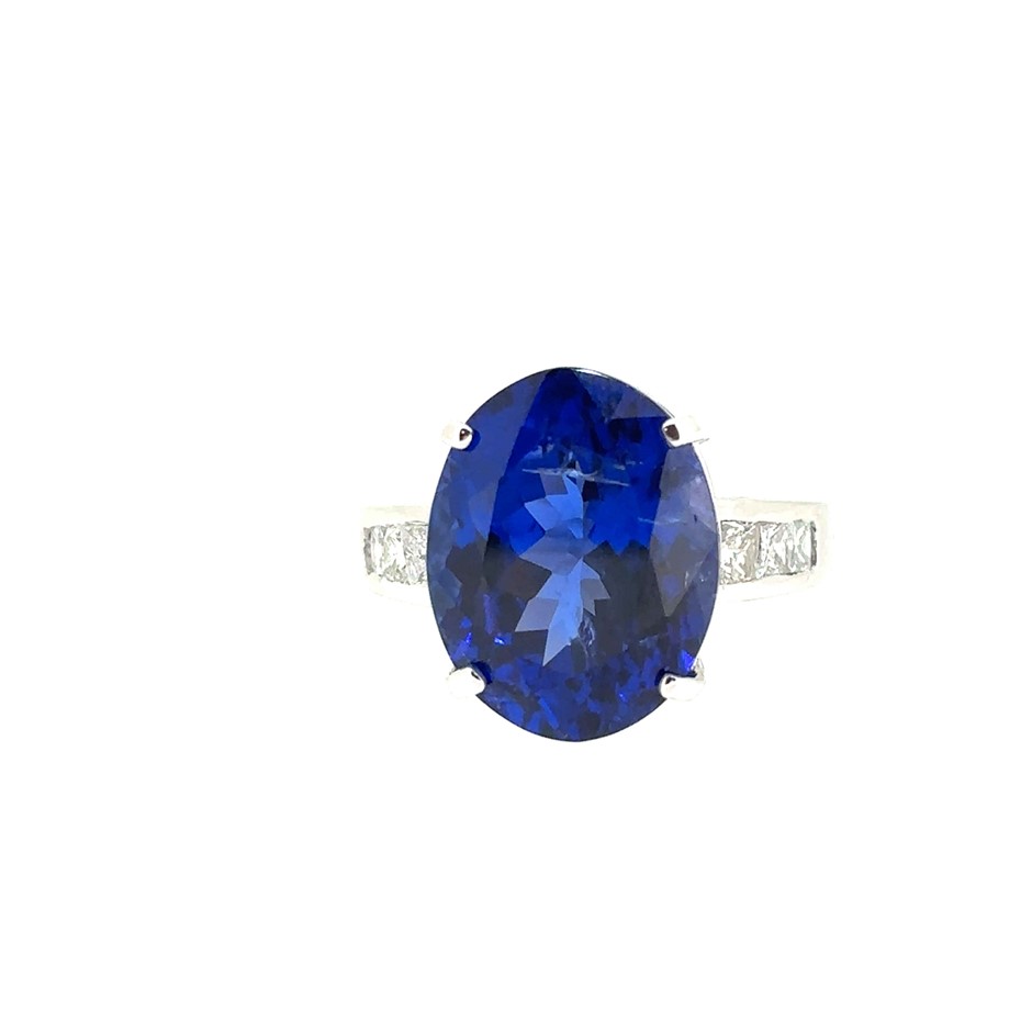 11.29ct an Oval Natural Tanzanite w/ AIG Cert. & 0.64ct 6 Stones Princess