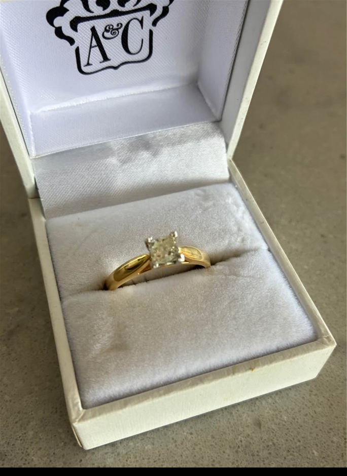 Diamond solitaire ring with princess cut 07oct diamond set in 18ct yellow