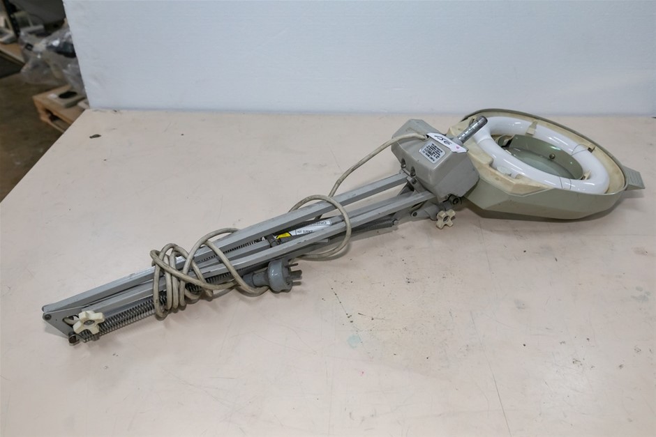 Magnifier with Illumination on Movable Arm