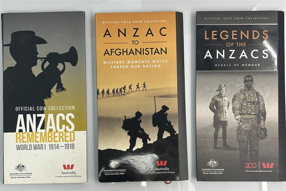 A collection of three official Royal Australian Mint ANZAC coin albums