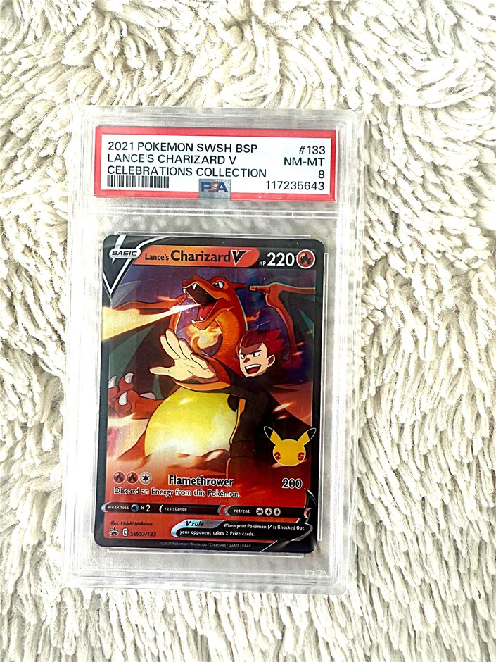 Lance’s Charizard V PSA 8 Celebrations promo holo.