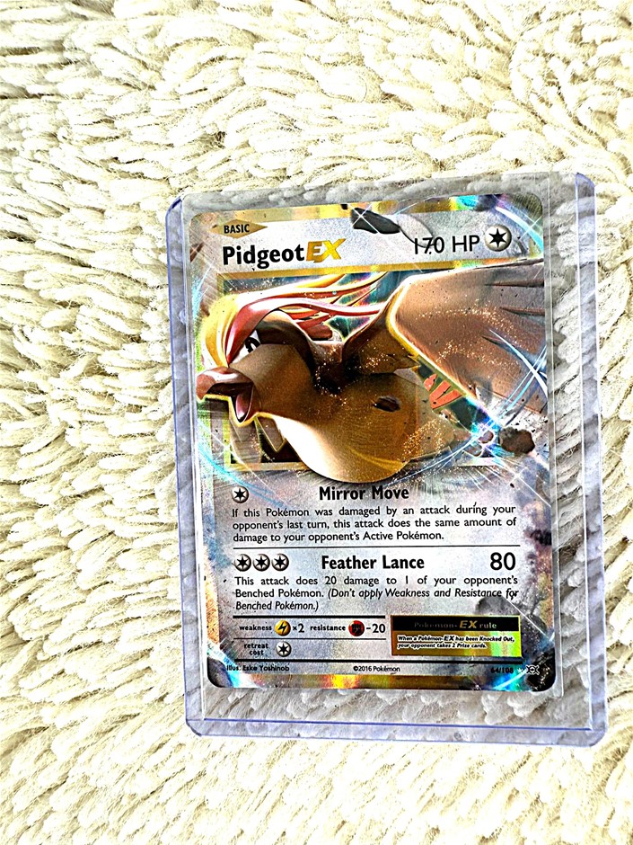 Pidgeot EX holographic flying-type Pokémon card.