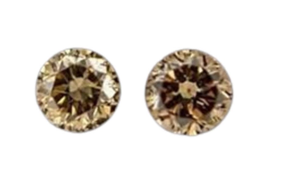 0.06 carat round 2 brown diamonds