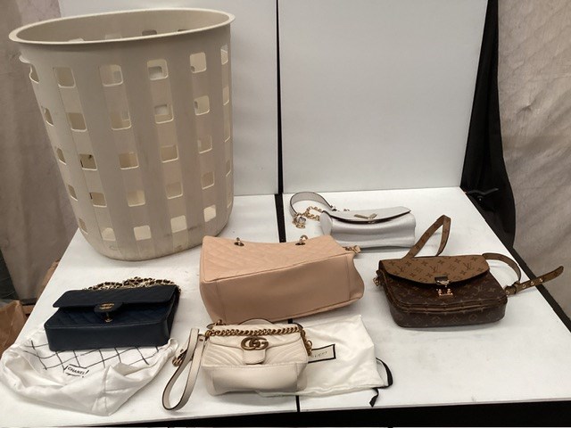 <p>Washing Basket Containing Brand Label Handbags/Purses</p>