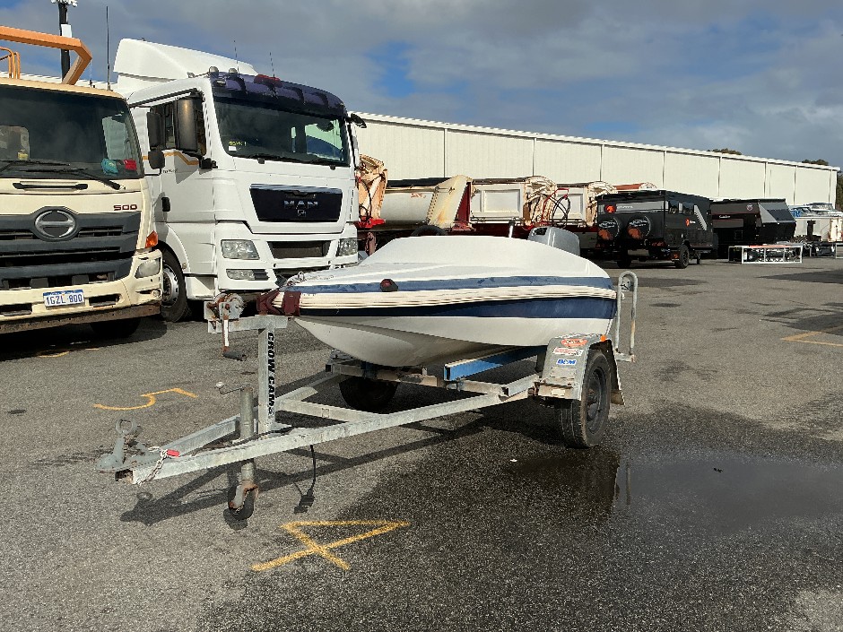 Small Boat on Trailer w/Outboard