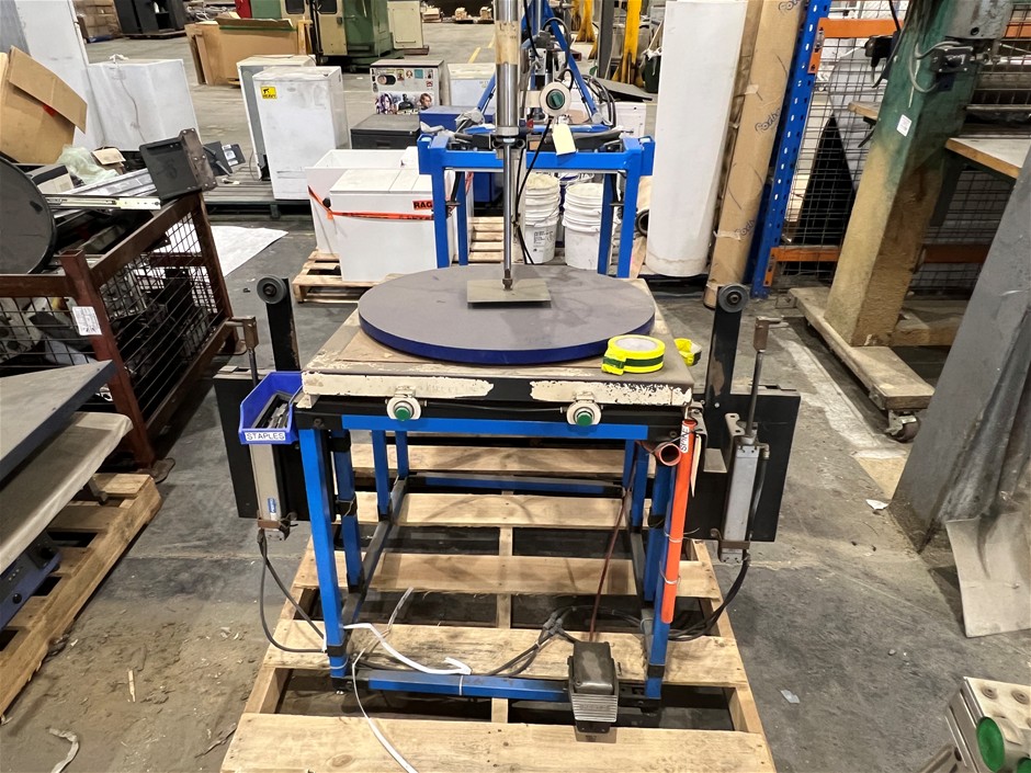 pneumatic rotary press workstation mounted on a welded steel frame.