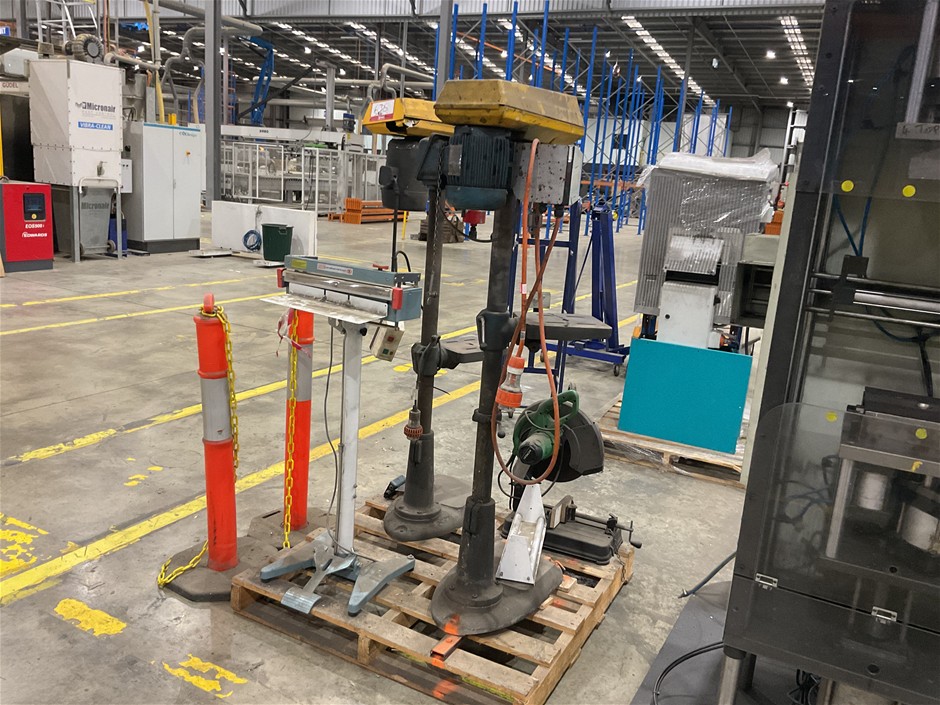Pallet of Drill Presses, drop-down saw and heat seal press.