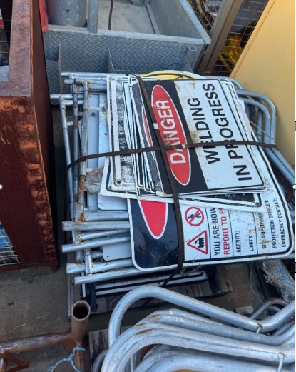 Pallets Of Various Construction Signage.