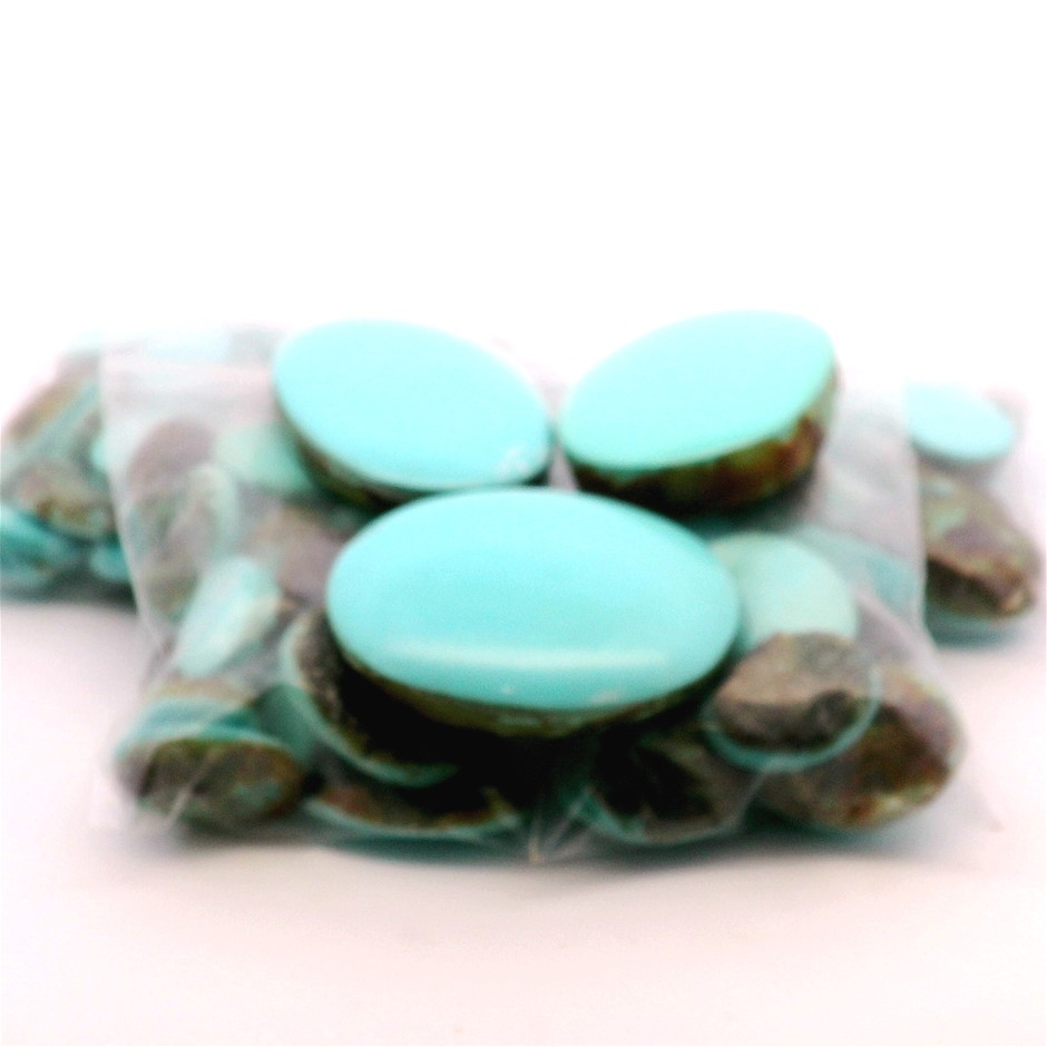 Eight (8) only bags of Synthetic Turquoise, Mixed Sizes. All Oval Cabochon.