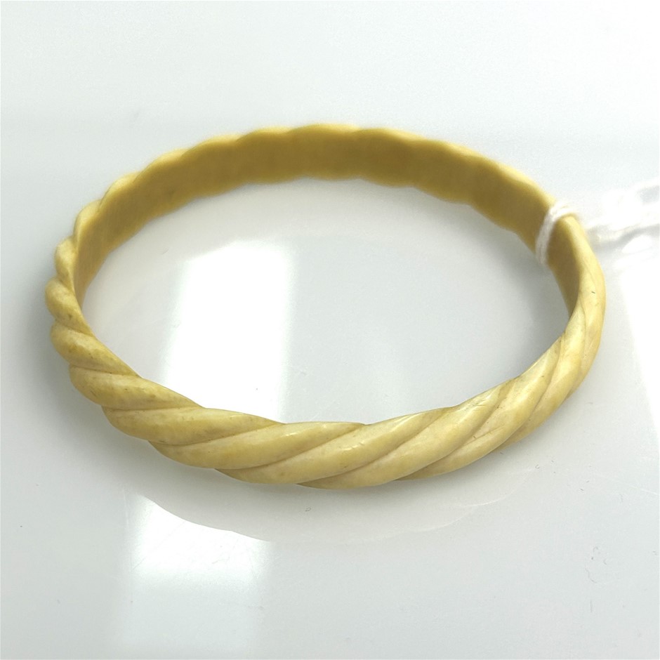 Carved bone twisted bangle bracelet