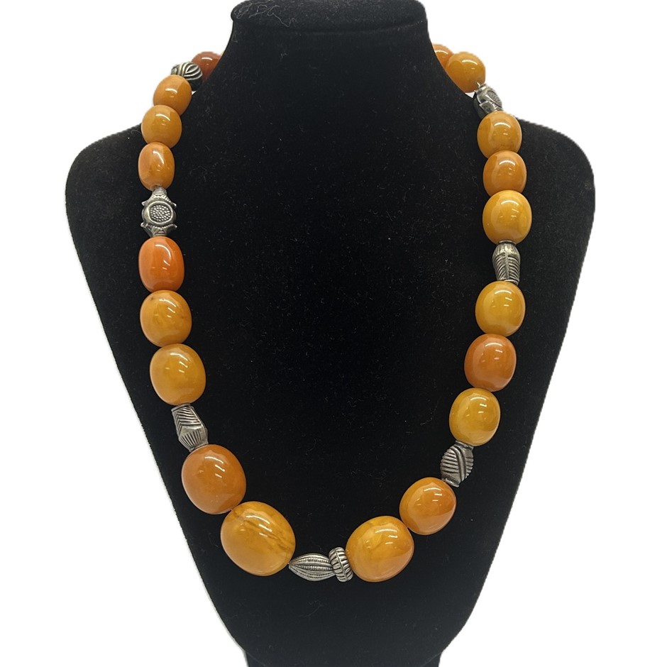 Baltic amber bead necklace featuring polished graduated oval amber beads