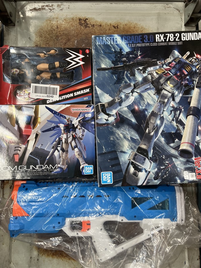 4 x Assorted Toy Products; Incl. Gundams, Wrestler Figurine, Toy Gun. NB: P