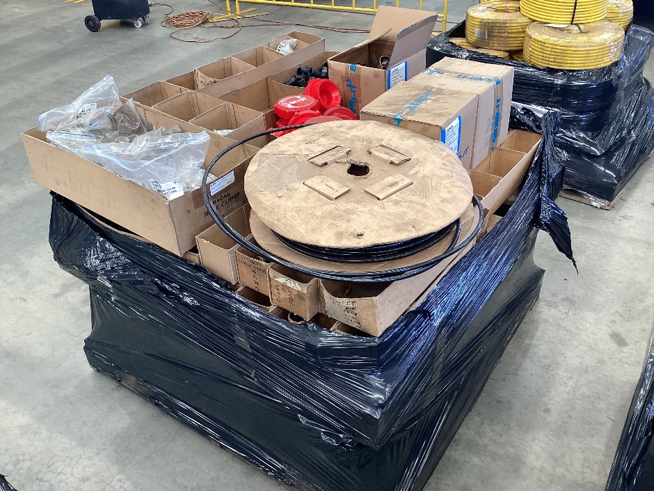 Pallet containing large assortment of pvc air hose, hose clamps, pipe f