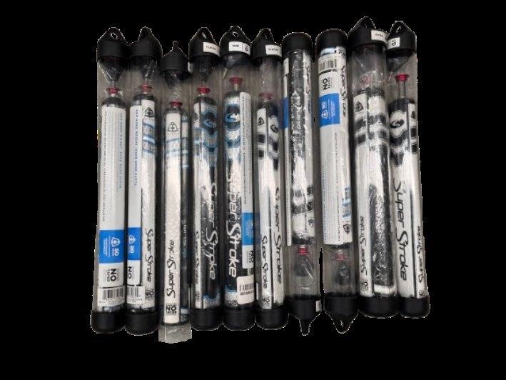 Assorted SUPER STROKE Gold Alignment Sticks.
