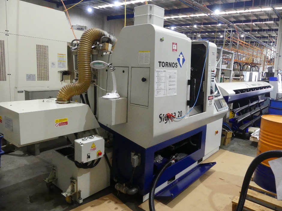 <p>2006 Tornos Swiss Sigma 20 CNC Automatic Lathe with Bar Feeder</p>