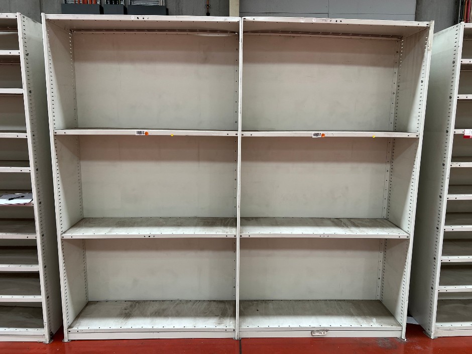 Double-bay metal shelving unit with adjustable shelf heights, double-sided