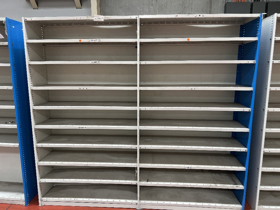 Double-bay metal shelving unit with adjustable shelf heights, double-sided