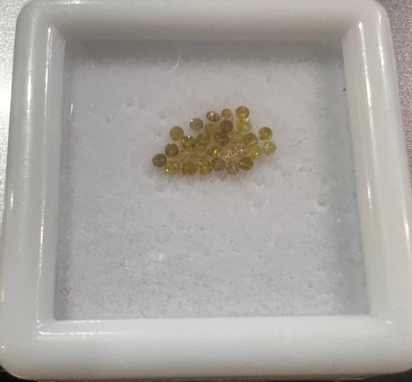 0.20 TCW yellow round various diamonds